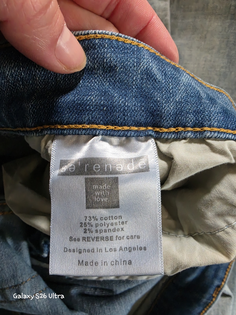 denim slim-fit distressed men's jeans in medium blue.